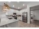Bright kitchen featuring stainless steel appliances, white cabinets and subway tile backsplash at 9642 E Tesla Ave, Mesa, AZ 85212