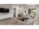 Inviting living room featuring a large sectional sofa and natural light at 9642 E Tesla Ave, Mesa, AZ 85212