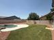 A refreshing pool with a large grassy area at 11006 S Indian Wells Dr, Goodyear, AZ 85338