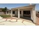 The backyard features a covered patio and lush green grass at 11006 S Indian Wells Dr, Goodyear, AZ 85338