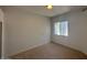 Bedroom with neutral carpet, window view, and ample natural light at 11006 S Indian Wells Dr, Goodyear, AZ 85338