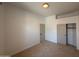 Bedroom with neutral carpet and closet door at 11006 S Indian Wells Dr, Goodyear, AZ 85338