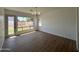 Dining area featuring vinyl flooring and large window with backyard view at 11006 S Indian Wells Dr, Goodyear, AZ 85338