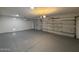 Spacious two-car garage with epoxy flooring and automatic door openers at 11006 S Indian Wells Dr, Goodyear, AZ 85338
