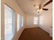 Cozy bedroom with neutral carpet, natural light, and a ceiling fan at 1381 E Prickly Pear Dr, Casa Grande, AZ 85122