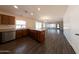 Open kitchen with wood cabinets, granite countertops, and stainless steel appliances at 1381 E Prickly Pear Dr, Casa Grande, AZ 85122
