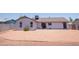 Home featuring a backyard with a gravel yard, patio and mature trees at 17810 N 34Th Pl, Phoenix, AZ 85032