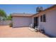 Backyard featuring gravel, patio and view of the home at 17810 N 34Th Pl, Phoenix, AZ 85032