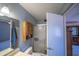 Bathroom featuring a shower, toilet, wall cabinet, and mirror with vanity lighting at 17810 N 34Th Pl, Phoenix, AZ 85032