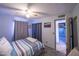 Bedroom with bed, carpet, ceiling fan, and view to another room at 17810 N 34Th Pl, Phoenix, AZ 85032
