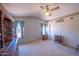 Bedroom features neutral carpet, a window, and dresser with mirror at 17810 N 34Th Pl, Phoenix, AZ 85032