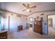 Bedroom with carpet, ceiling fan, and access to the bathroom at 17810 N 34Th Pl, Phoenix, AZ 85032