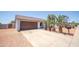Attractive single-story home with a large driveway, desert landscaping, and an attached two-car garage at 17810 N 34Th Pl, Phoenix, AZ 85032