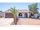 Charming single-story home with arched entry, desert landscaping, and a spacious two-car garage at 17810 N 34Th Pl, Phoenix, AZ 85032