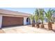 Attractive single-story home with a large driveway, desert landscaping, and an attached two-car garage at 17810 N 34Th Pl, Phoenix, AZ 85032