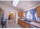 Bright kitchen showcasing a window, stainless steel appliances, and wood cabinets at 17810 N 34Th Pl, Phoenix, AZ 85032