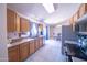Bright kitchen showcasing stainless steel appliances, wood cabinets, and tile floors at 17810 N 34Th Pl, Phoenix, AZ 85032