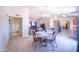 Open-concept living space featuring carpet, dining area, and kitchen with stainless steel appliances at 17810 N 34Th Pl, Phoenix, AZ 85032