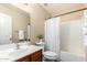 Bathroom featuring a vanity, a shower with white curtain and toilet at 18774 N Ibis Way, Maricopa, AZ 85138