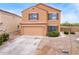 Charming two-story home featuring a two-car garage and beautiful desert landscaping at 18774 N Ibis Way, Maricopa, AZ 85138