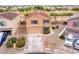 Inviting two-story home with a well-maintained yard and a two-car garage at 18774 N Ibis Way, Maricopa, AZ 85138