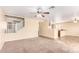 Open-concept living room with an easy flow into the kitchen and second floor access at 18774 N Ibis Way, Maricopa, AZ 85138