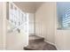 Carpeted staircase featuring white railing and neutral walls at 18774 N Ibis Way, Maricopa, AZ 85138