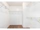 Spacious walk-in closet features carpet flooring, white walls and metal shelving at 18774 N Ibis Way, Maricopa, AZ 85138