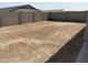 Unfinished backyard space with a privacy wall at 24105 W Bowker St, Buckeye, AZ 85326