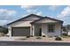 Charming single-story home featuring a two-car garage and low-maintenance landscaping at 24105 W Bowker St, Buckeye, AZ 85326