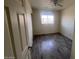 Bright bedroom with wood-look floors, ceiling fan, and a large window for natural light at 3143 W Glendale Ave, Phoenix, AZ 85051