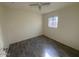 Cozy bedroom with wood-look flooring, and neutral decor at 3143 W Glendale Ave, Phoenix, AZ 85051