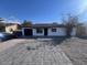 Charming single-story home featuring a well-maintained front yard and modern driveway at 3143 W Glendale Ave, Phoenix, AZ 85051