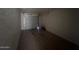 Spacious garage with a roll-up door, offering ample space for parking at 3143 W Glendale Ave, Phoenix, AZ 85051