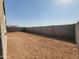 Expansive backyard enclosed by a block fence, offering ample space for customization and outdoor activities at 3781 N Camden Dr, Florence, AZ 85132
