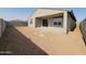 A spacious backyard featuring a covered patio and block fencing, providing privacy and outdoor living space at 3781 N Camden Dr, Florence, AZ 85132