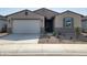 Charming single-Gathering home with a well-maintained front yard, a two-car garage, and a welcoming entrance at 3781 N Camden Dr, Florence, AZ 85132