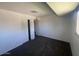 A carpeted bedroom with double door closet and a window at 4332 W Ocotillo Rd # 206, Glendale, AZ 85301
