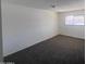 A view of the bedroom featuring carpeted floors, ample natural light, and neutral walls at 4332 W Ocotillo Rd # 206, Glendale, AZ 85301