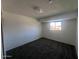 A view of the bedroom featuring carpeted floors, ample natural light, and neutral walls at 4332 W Ocotillo Rd # 206, Glendale, AZ 85301