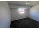 A carpeted bedroom with a window at 4332 W Ocotillo Rd # 206, Glendale, AZ 85301