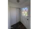 An entryway with tiled floors, a front door, and a closet at 4332 W Ocotillo Rd # 206, Glendale, AZ 85301