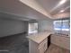 Bright living room featuring an open floor plan to the kitchen area and sliding glass doors at 4332 W Ocotillo Rd # 206, Glendale, AZ 85301
