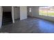An open living room area with stairs and a view from the window at 4332 W Ocotillo Rd # 206, Glendale, AZ 85301