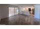 Spacious living room featuring an open floor plan to the kitchen and access to the patio at 4332 W Ocotillo Rd # 206, Glendale, AZ 85301