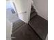 A view from the top of a carpeted staircase at 4332 W Ocotillo Rd # 206, Glendale, AZ 85301