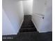 Carpeted stairway with white walls and handrail at 4332 W Ocotillo Rd # 206, Glendale, AZ 85301