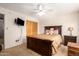 Comfortable bedroom with carpeting, ceiling fan, and natural light at 509 N 56 St, Mesa, AZ 85205