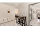 Dining area featuring tiled floors and views of the living room and outdoor patio at 509 N 56 St, Mesa, AZ 85205