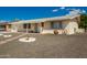 Charming single-story home with desert landscaping, walkway, and covered porch at 509 N 56 St, Mesa, AZ 85205